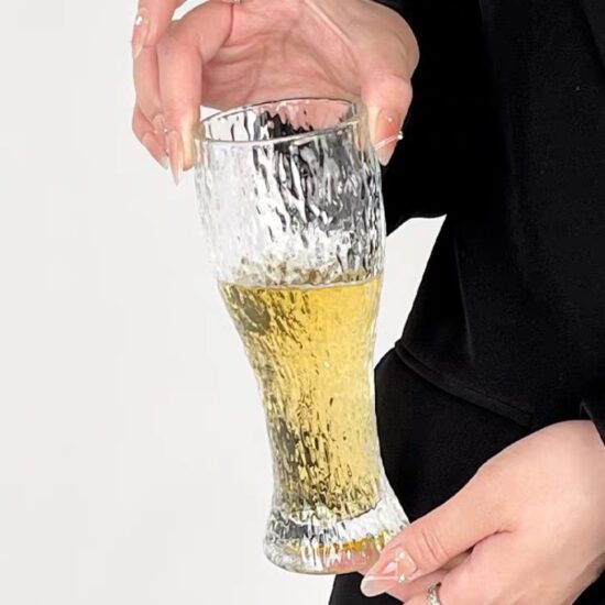 Hammered glass beer mug with retro style for craft drinks and water