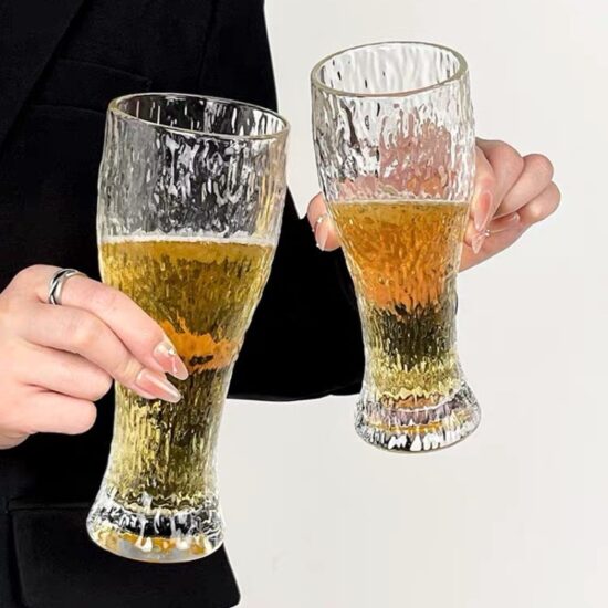 Hammered glass beer mug with retro style for craft drinks and water