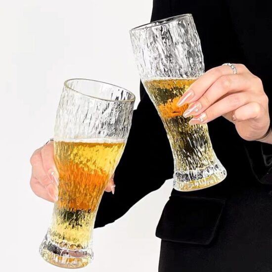 Hammered glass beer mug with retro style for craft drinks and water